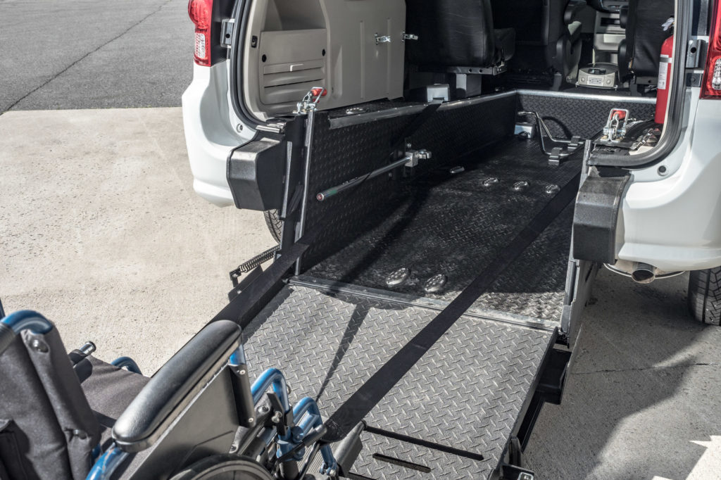 Rear entry wheelchair accessible conversion mini van ramp